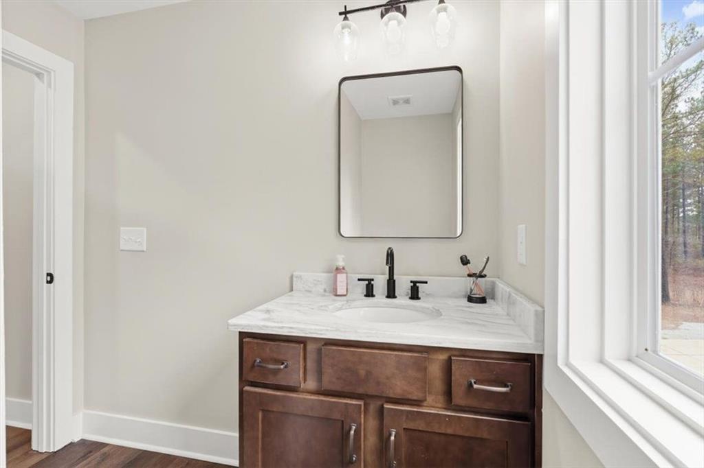 1270 McGarity Road Temple, GA 30179 - Photo 31 of 58 a bathroom with a sink and a mirror