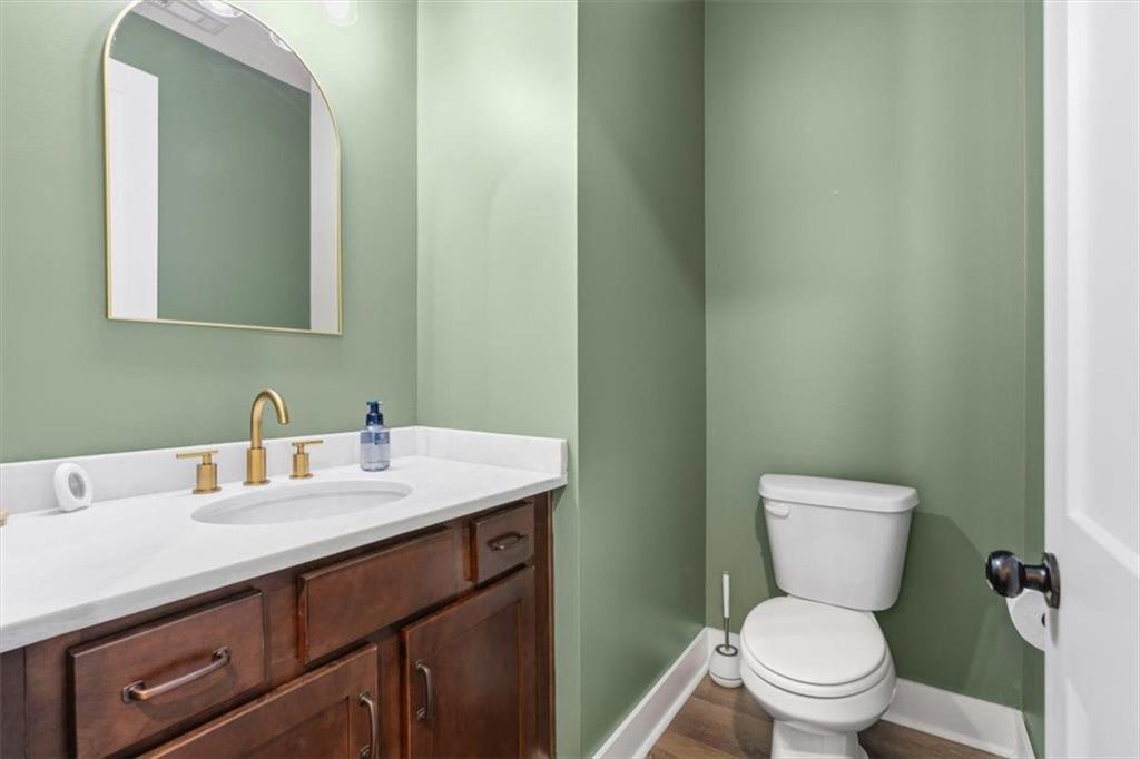1270 McGarity Road Temple, GA 30179 - Photo 36 of 58 a bathroom with a granite countertop toilet sink and mirror