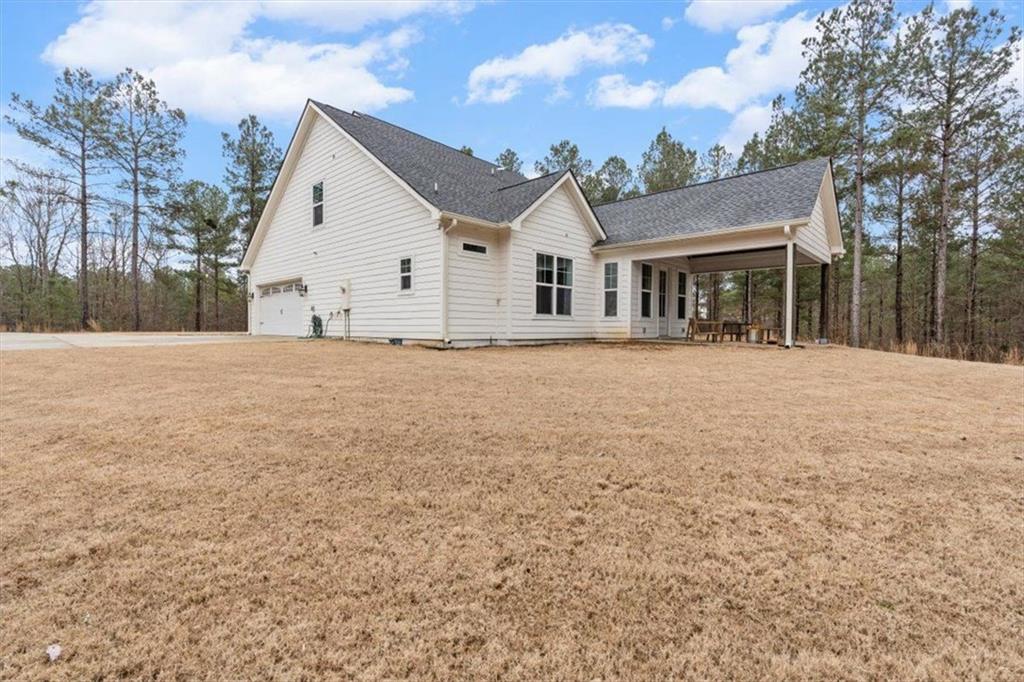 1270 McGarity Road Temple, GA 30179 - Photo 42 of 58 a front view of a house with a yard