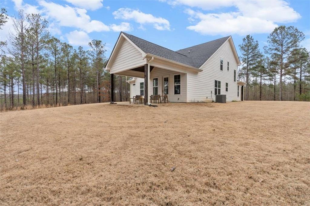 1270 McGarity Road Temple, GA 30179 - Photo 44 of 58 a view of an house with backyard and trees