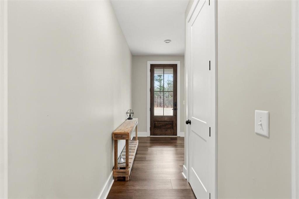 1270 McGarity Road Temple, GA 30179 - Photo 9 of 58 a view of a hallway with a wooden floor