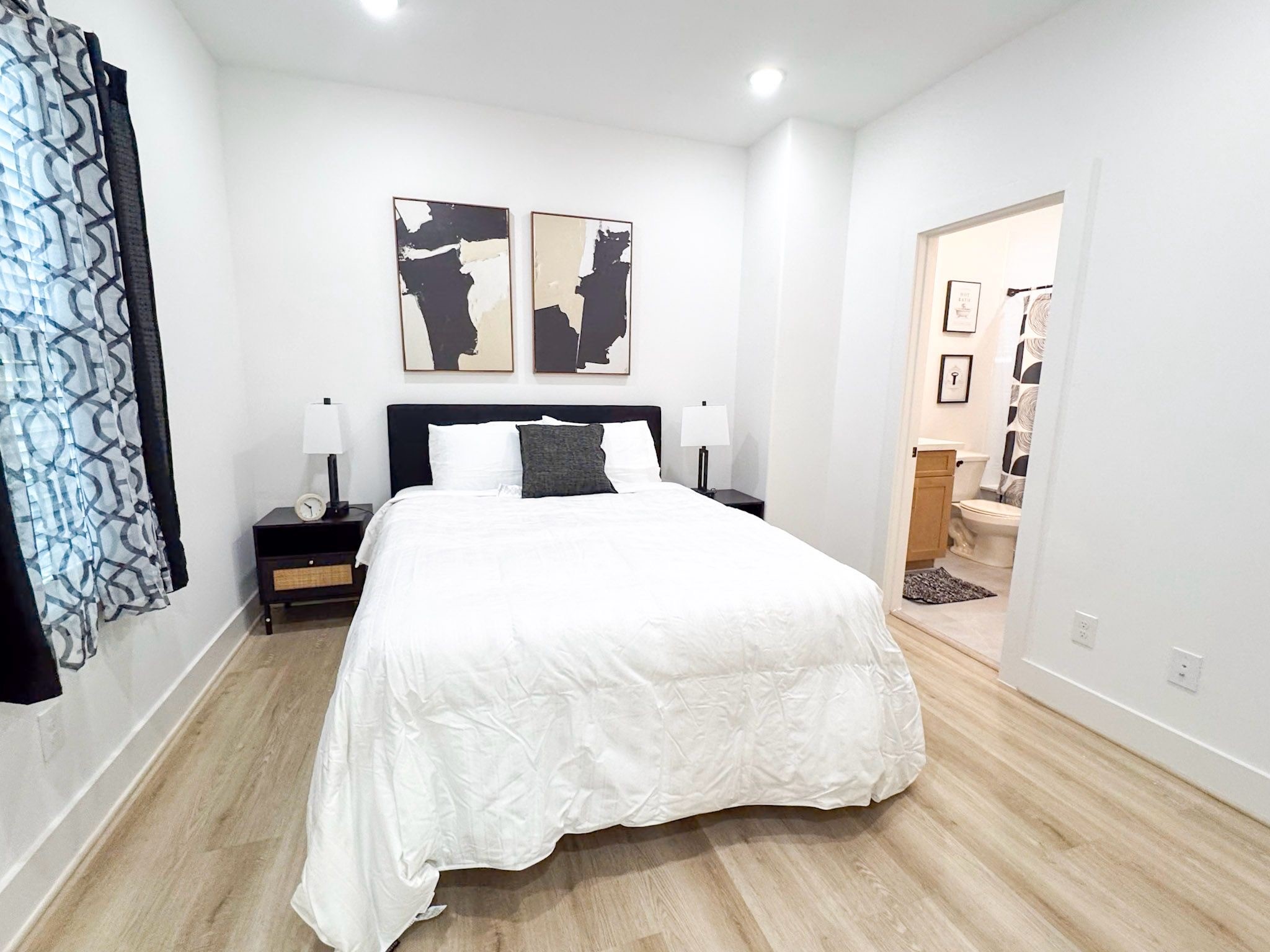 2706 Cochran Street Houston, TX 77009 - Photo 11 of 23 a large white bed in a white room
