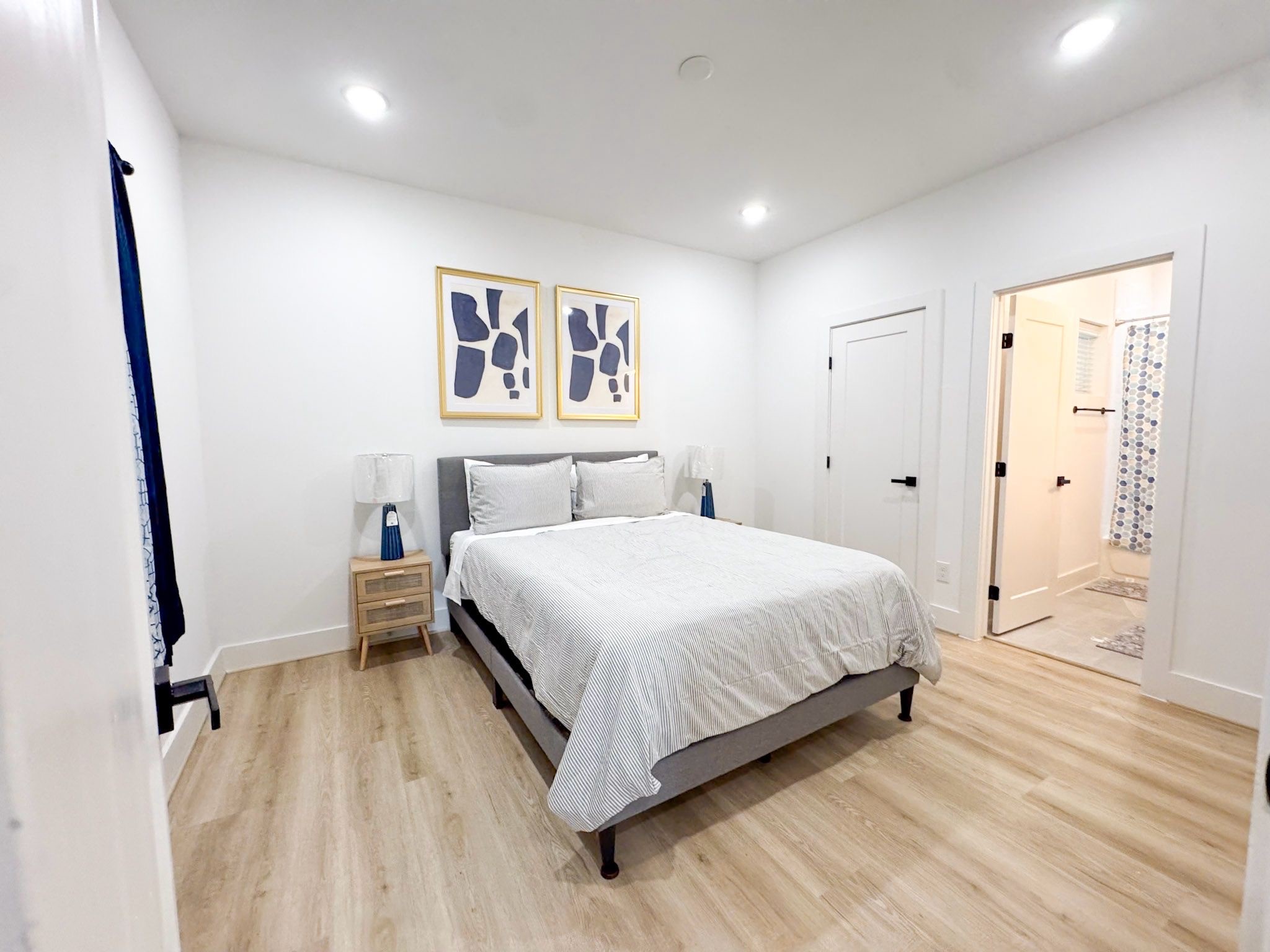 2706 Cochran Street Houston, TX 77009 - Photo 13 of 23 a bedroom with a bed and a mirror