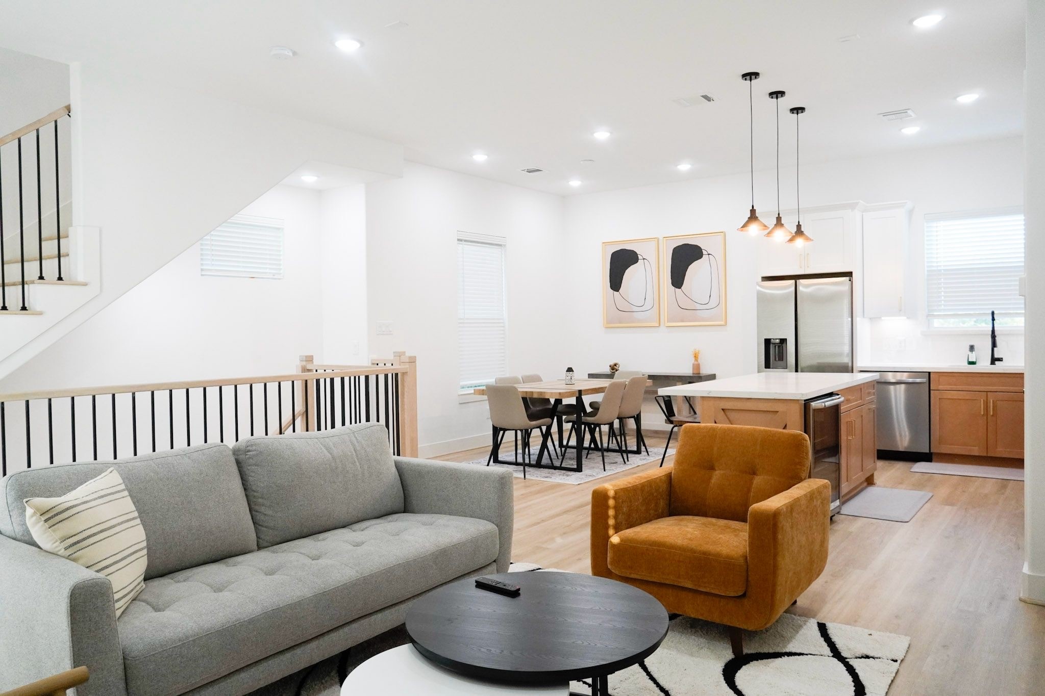 2706 Cochran Street Houston, TX 77009 - Photo 18 of 23 a living room with furniture kitchen view and a chandelier