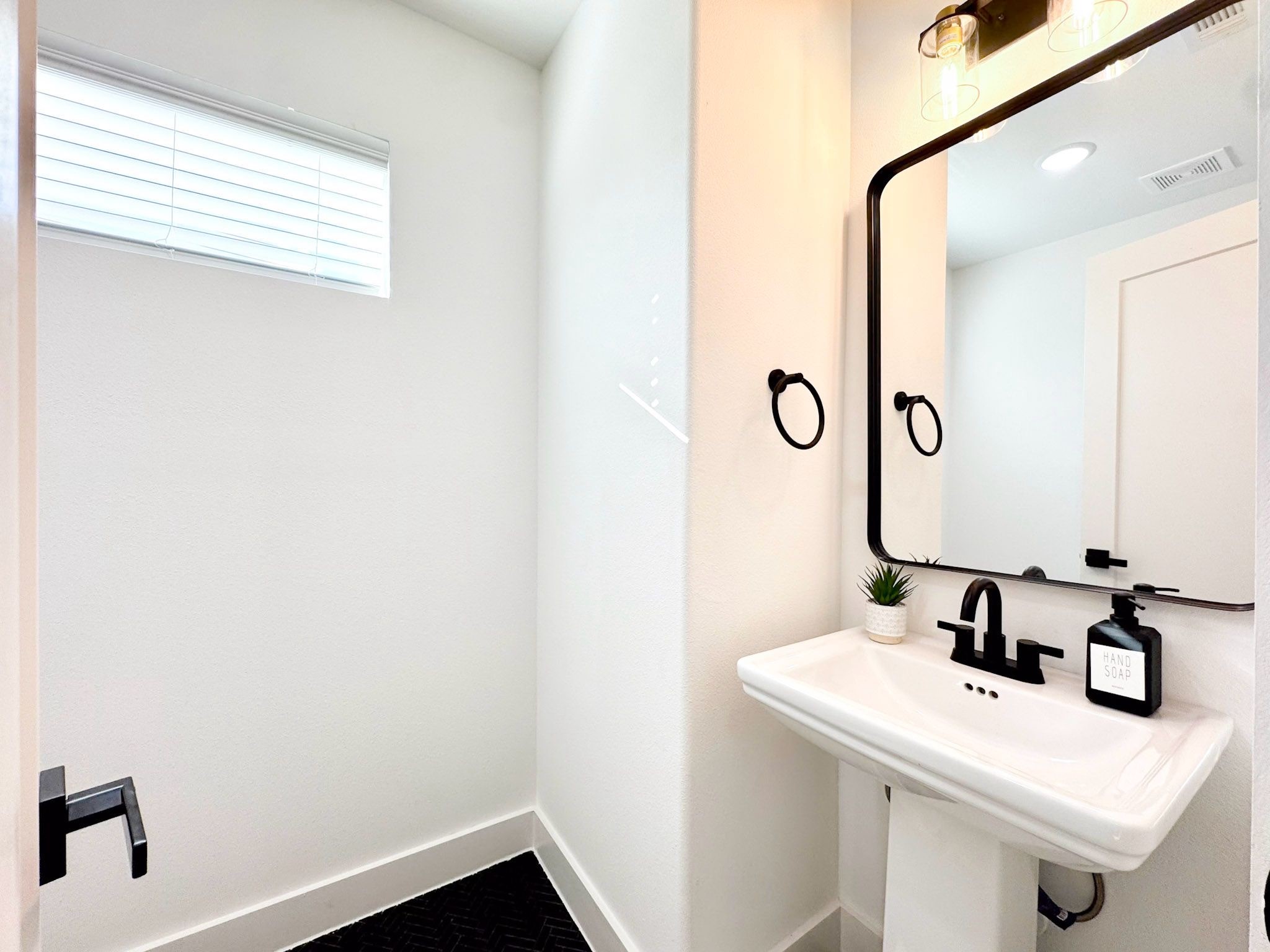 2706 Cochran Street Houston, TX 77009 - Photo 8 of 23 a bathroom with a sink and a mirror