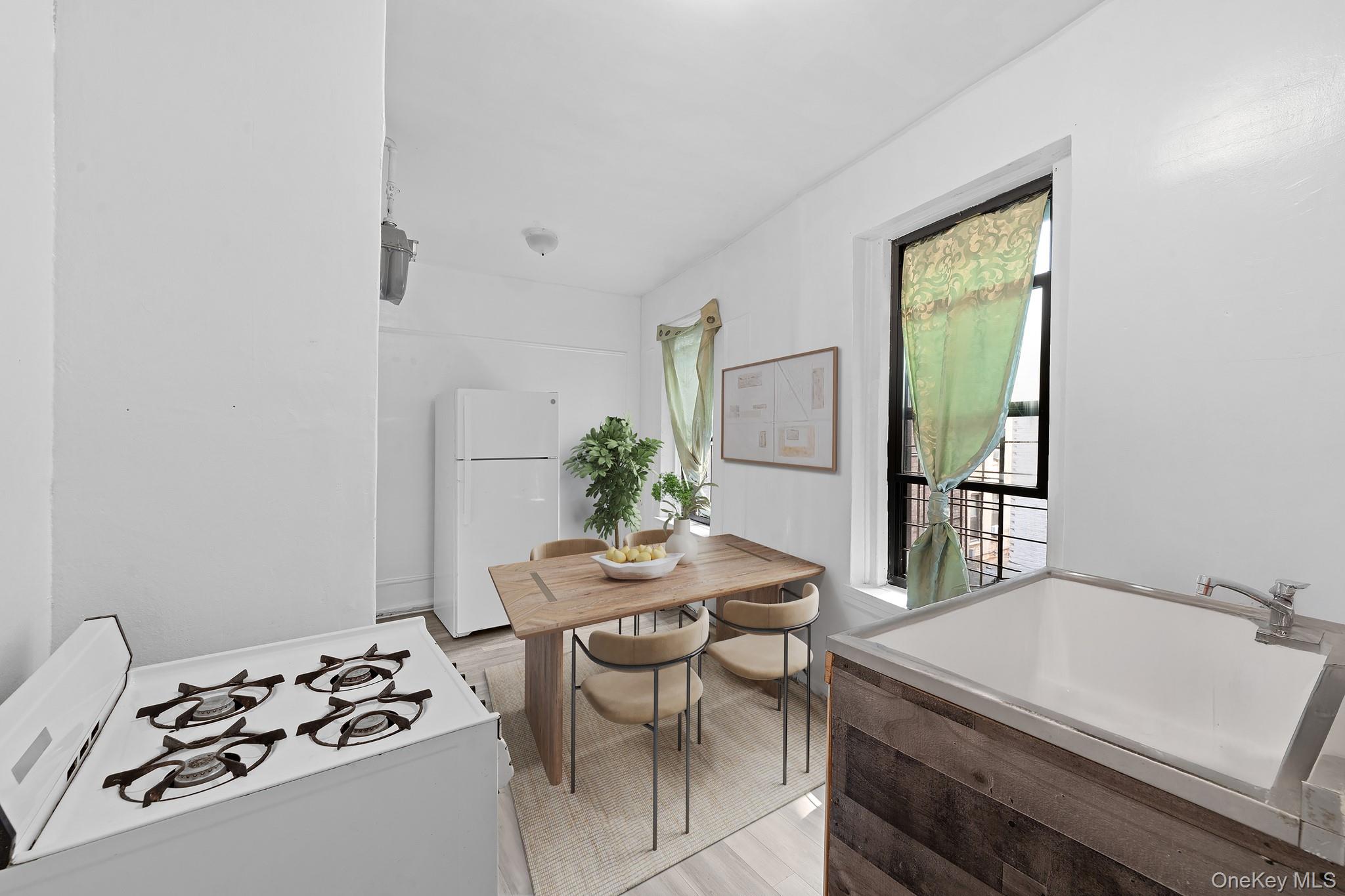 941 Jerome Avenue, Unit 11C Bronx, NY 10452 - Photo 7 of 14 Dining room featuring light wood finished floors
