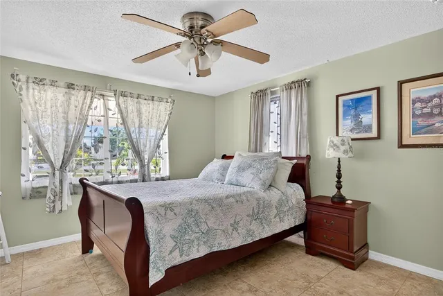 a bedroom with a bed and a table