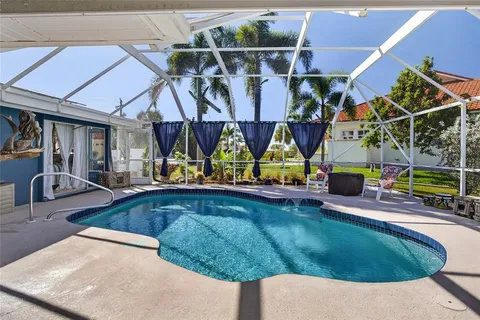 a view of swimming pool with outdoor seating