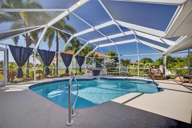 a view of a patio with a table and chairs