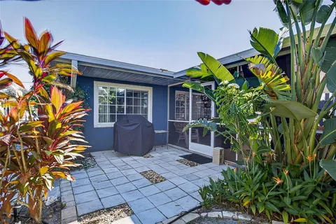 a house with a plant in front of it