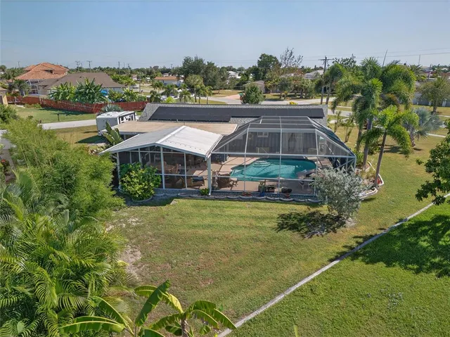 a aerial view of a house with garden space and street view