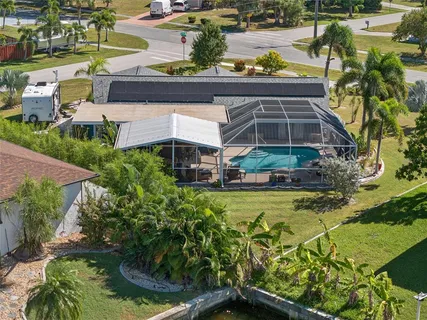 a view of a swimming pool with a yard