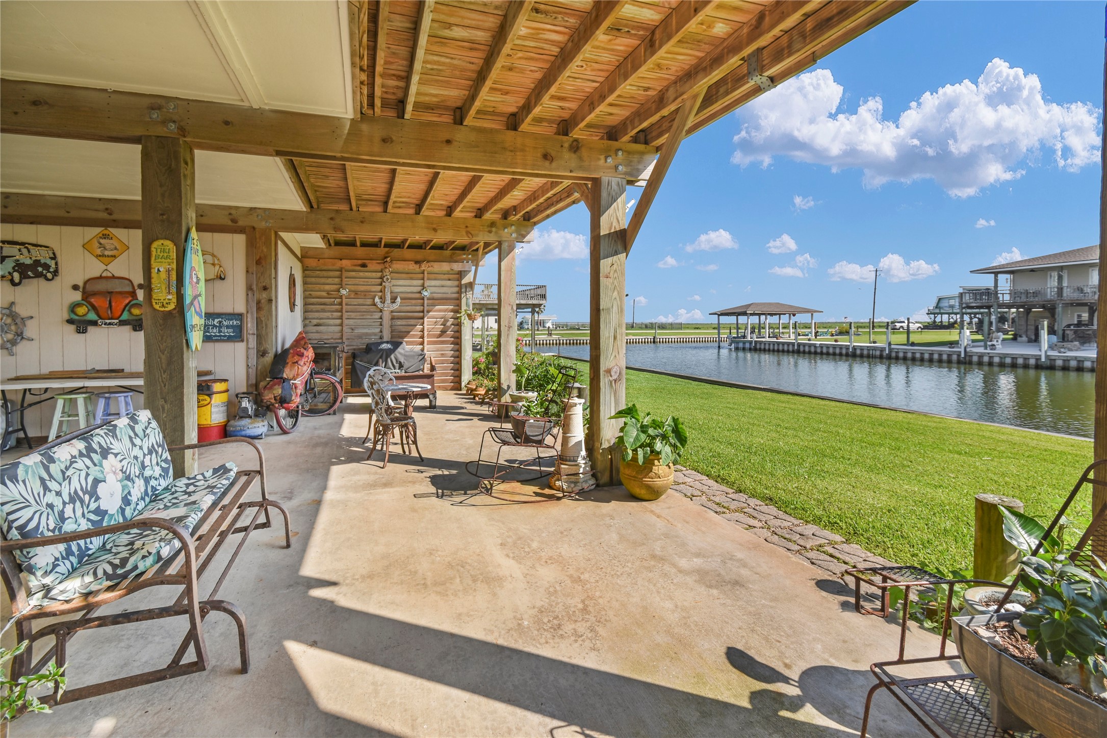 115 Driftwood Road Freeport, TX 77541 - Photo 3 of 21 a view of a swimming pool with a table and chairs