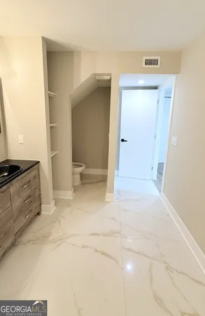 a bathroom with a sink a vanity and mirror