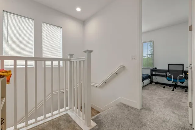 a bathroom with a granite countertop sink mirror and double