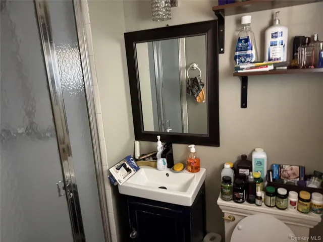 a bathroom with a sink a mirror and vanity