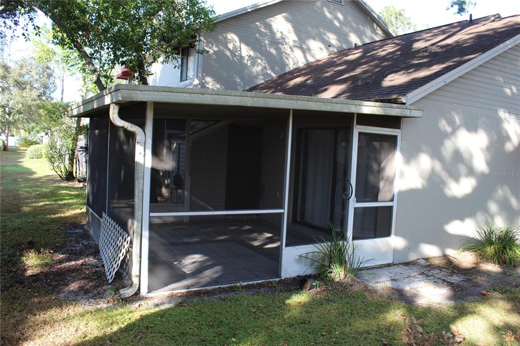 8418 Laurelon Place Temple Terrace, FL 33637 - Photo 12 of 13 a front view of house with yard
