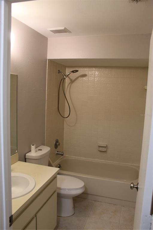 8418 Laurelon Place Temple Terrace, FL 33637 - Photo 7 of 13 a bathroom with a sink a toilet and shower