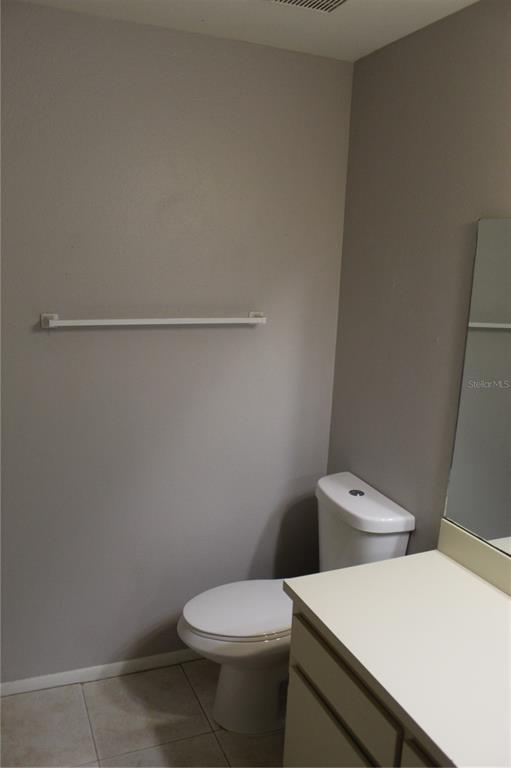 8418 Laurelon Place Temple Terrace, FL 33637 - Photo 9 of 13 a white toilet sitting next to a white wall