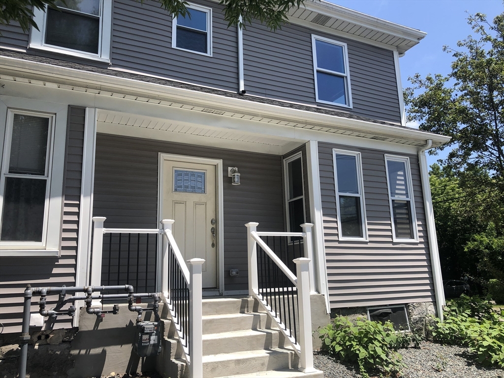 28-32 Calvary Street Waltham, MA 02453 - Photo 2 of 41 a view of a house with more windows and plants