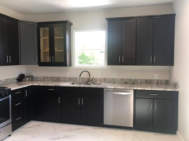 a kitchen with a sink and a stove