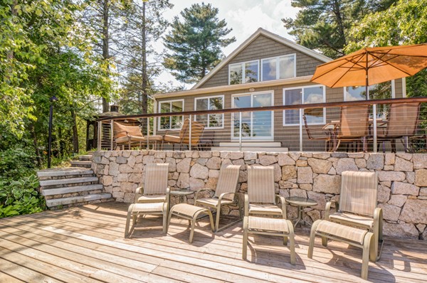 122 Barton Road Stow, MA 01775 - Photo 1 of 30 a view of a house with backyard and sitting area