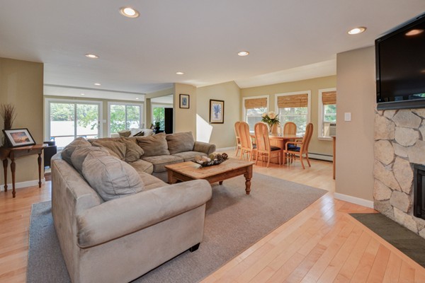 122 Barton Road Stow, MA 01775 - Photo 15 of 30 a living room with fireplace furniture and a flat screen tv