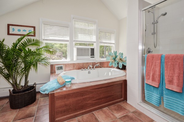 122 Barton Road Stow, MA 01775 - Photo 23 of 30 a spacious bathroom with a bathtub and potted plant