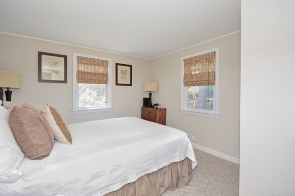 122 Barton Road Stow, MA 01775 - Photo 25 of 30 a bedroom with a bed and a window