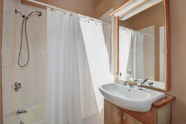 122 Barton Road Stow, MA 01775 - Photo 27 of 30 a bathroom with a sink a mirror a shower and a mirror