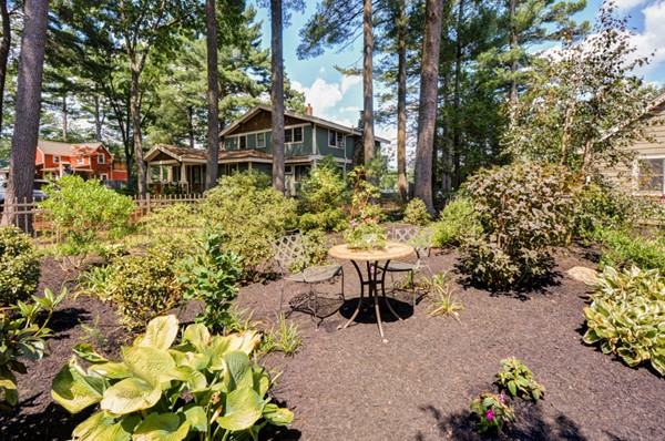 122 Barton Road Stow, MA 01775 - Photo 5 of 30 a view of a house with a yard and sitting area