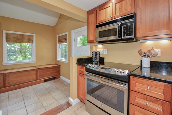 122 Barton Road Stow, MA 01775 - Photo 9 of 30 a kitchen with stainless steel appliances granite countertop a stove and a microwave