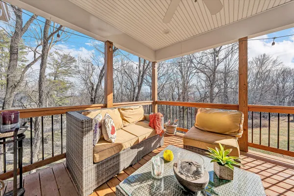 a view of a balcony with furniture