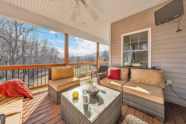 swimming outdoor sitting area with furniture and wooden floor