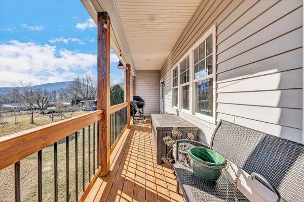 a view of a balcony with furniture
