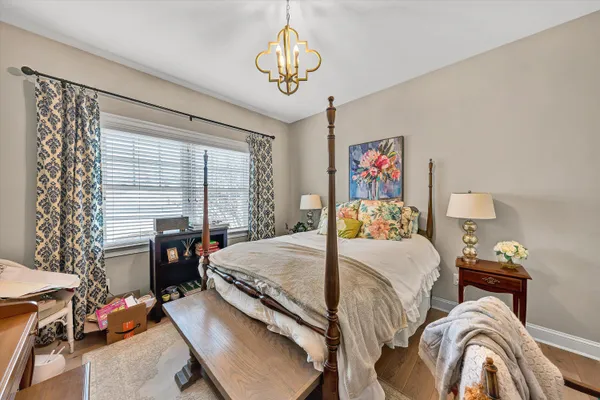 a bedroom with bed and a window