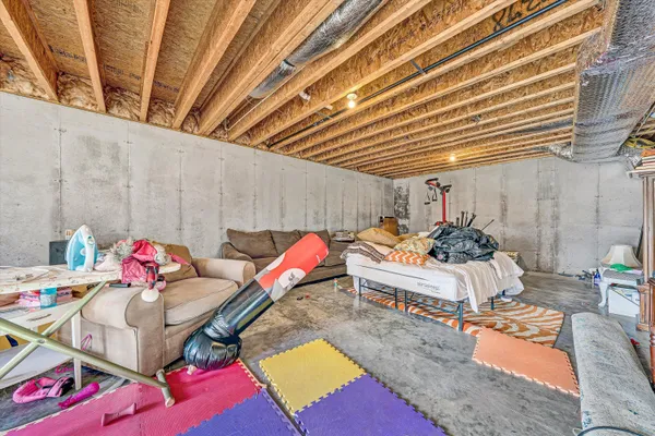 a living room with furniture and a table
