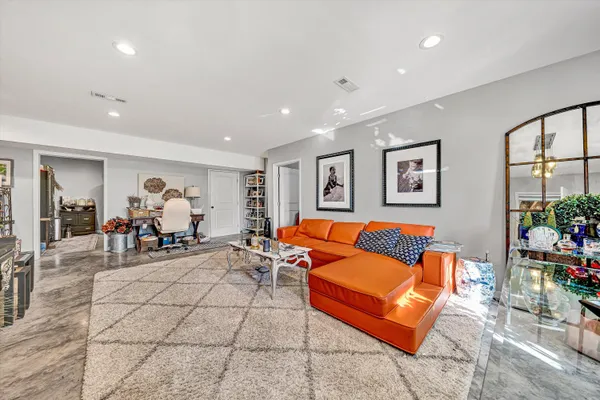 a living room with furniture and window