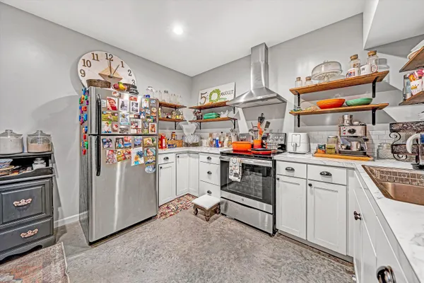 a storage utility room with cabinets washer and dryer