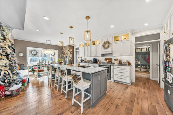 a large kitchen with lots of counter space and stainless steel appliances