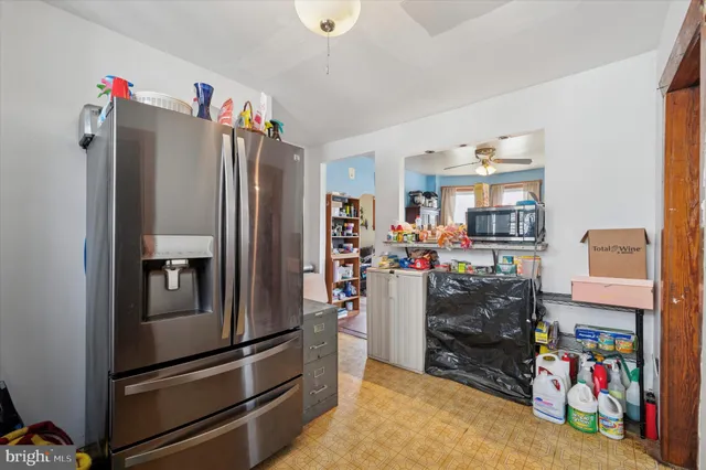 a kitchen view of a refrigerator and storage