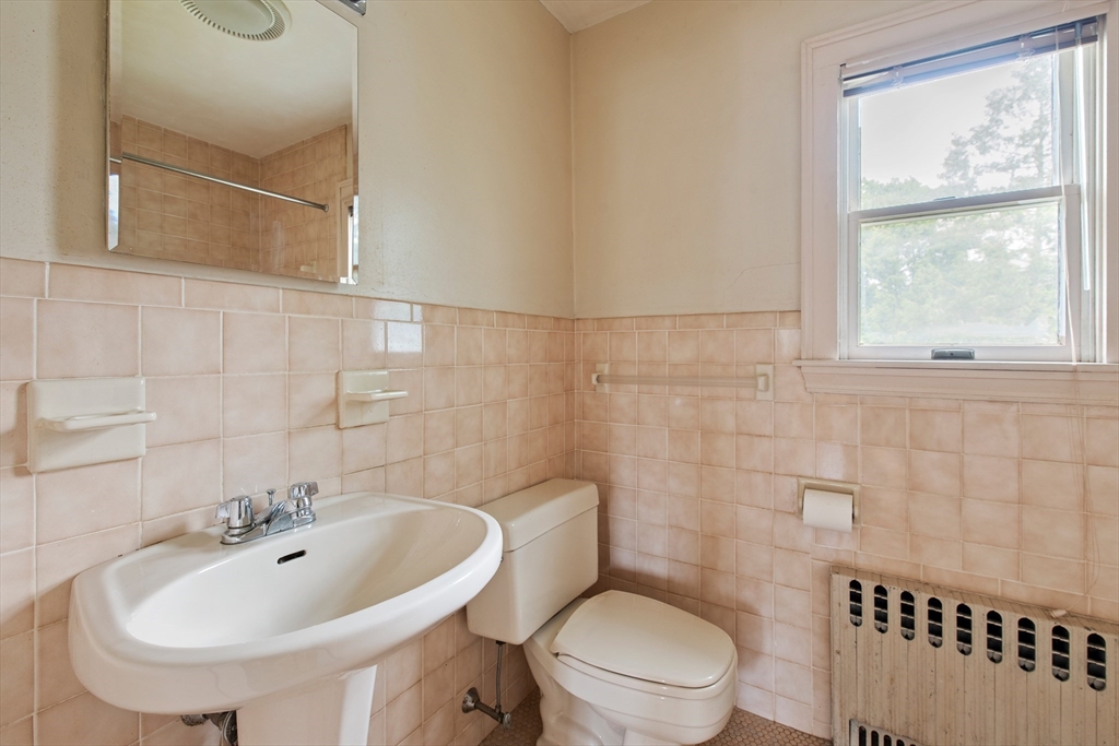 38 Bailey Road Arlington, MA 02476 - Photo 14 of 30 a bathroom with a sink a toilet and shower