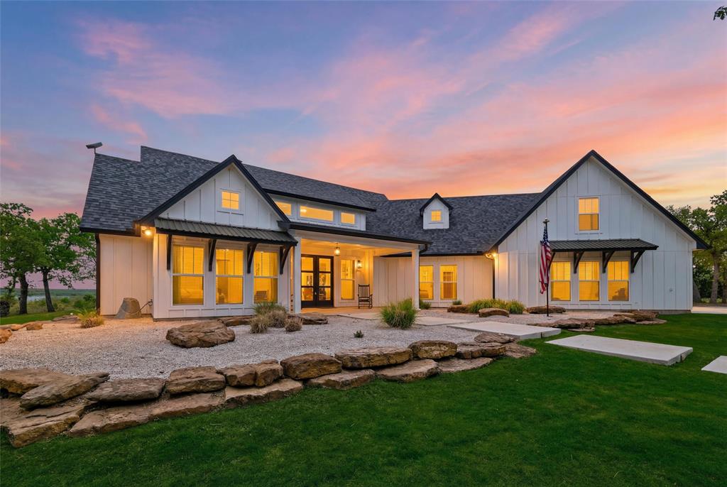 434 Sandstone Court Sunset, TX 76270 - Photo 1 of 40 a front view of a house with a yard