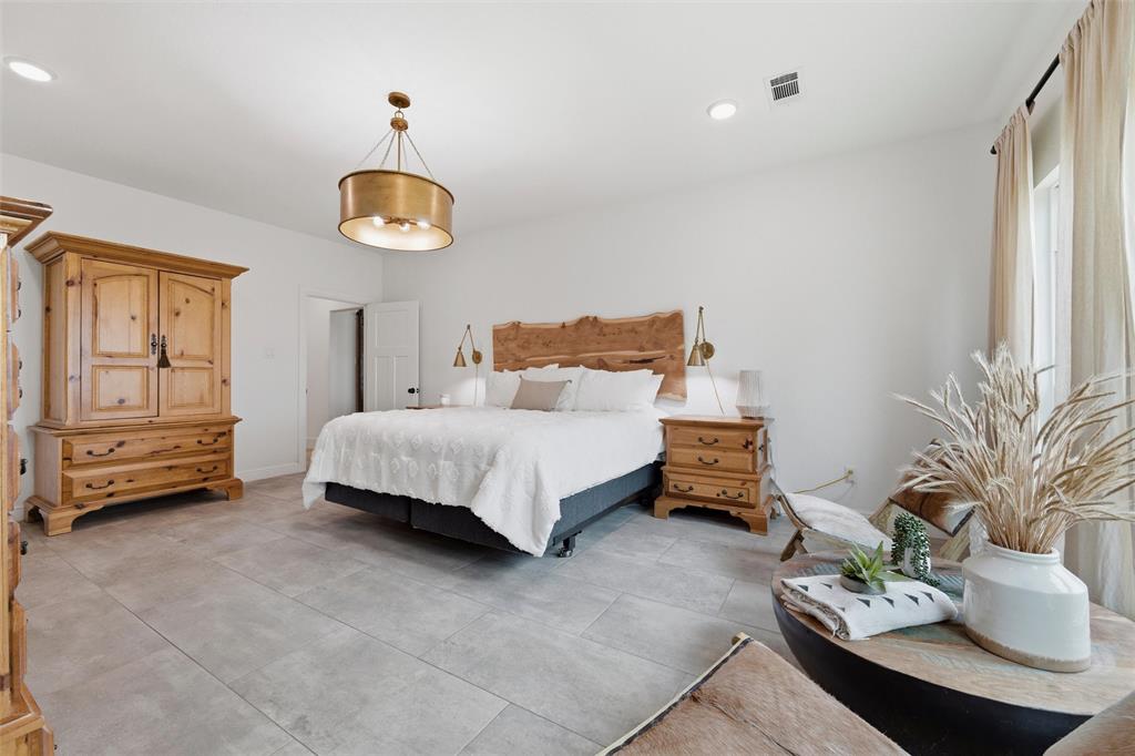 434 Sandstone Court Sunset, TX 76270 - Photo 16 of 40 a bedroom with a bed and furniture