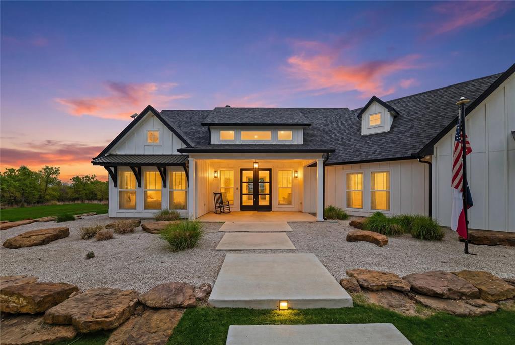 434 Sandstone Court Sunset, TX 76270 - Photo 2 of 40 a front view of a house with a yard
