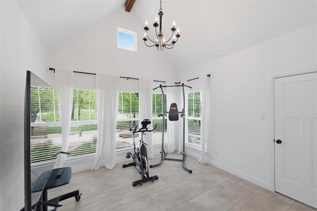 434 Sandstone Court Sunset, TX 76270 - Photo 23 of 40 a view of a room with gym equipment