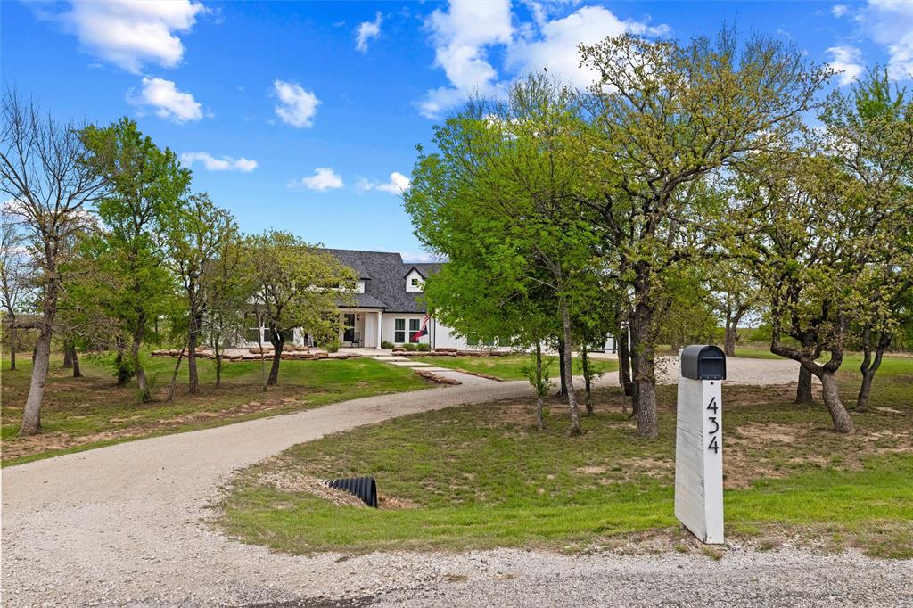 434 Sandstone Court Sunset, TX 76270 - Photo 3 of 40 a view of a park with large trees