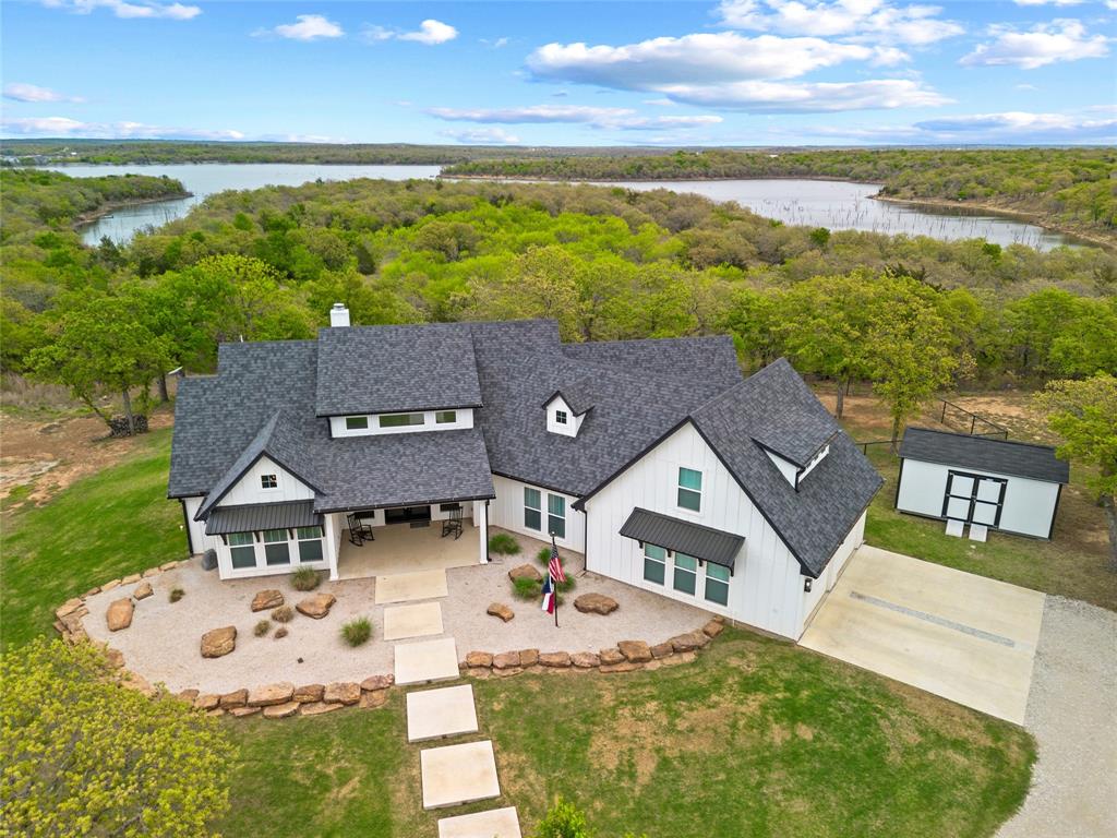 434 Sandstone Court Sunset, TX 76270 - Photo 32 of 40 a view of house with ocean view