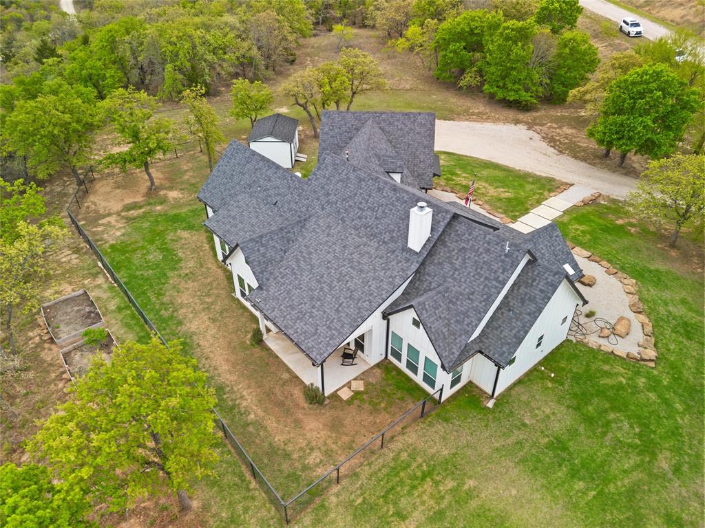 434 Sandstone Court Sunset, TX 76270 - Photo 33 of 40 an aerial view of a house with a yard