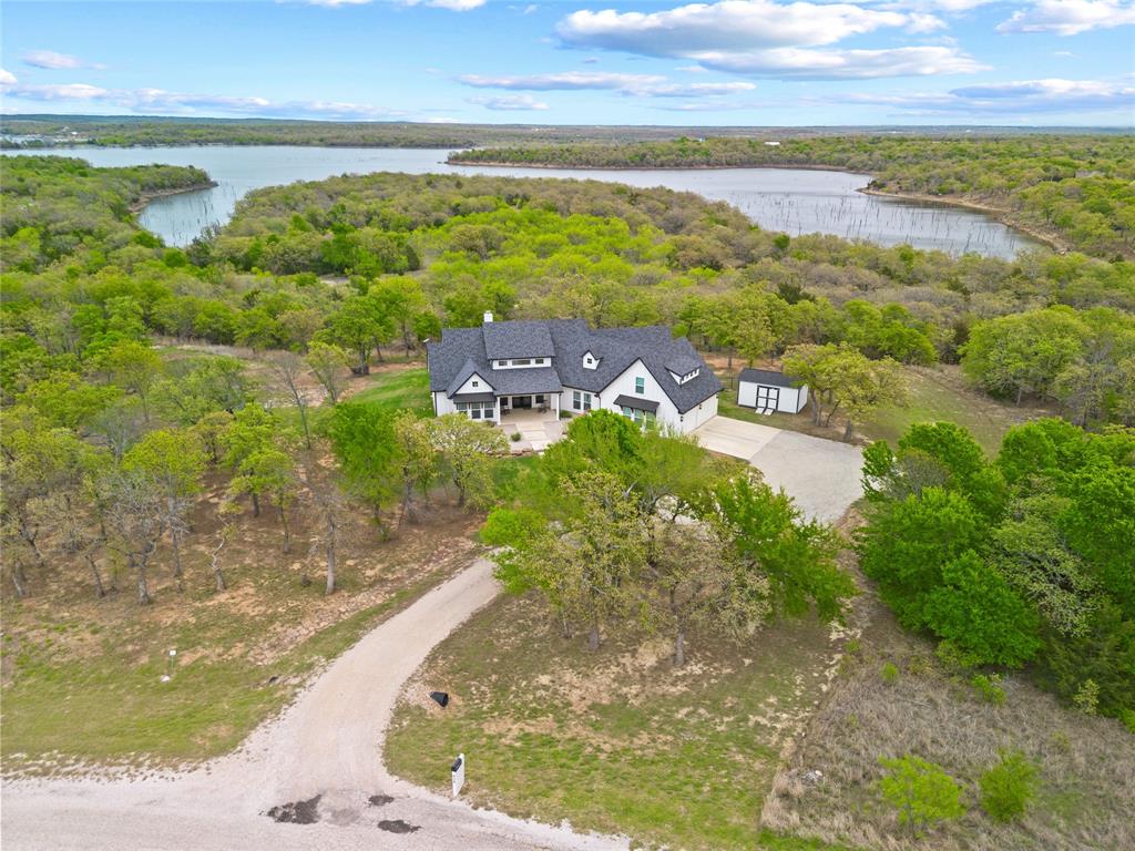 434 Sandstone Court Sunset, TX 76270 - Photo 34 of 40 a view of a lake with beach and ocean view